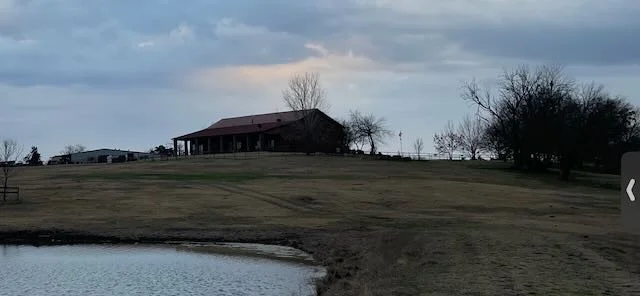 Ranch buildings and barn facilities with lake view
